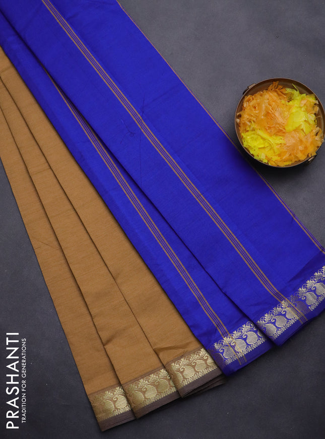 Semi silk cotton saree dark sandal and blue with plain body and zari woven border