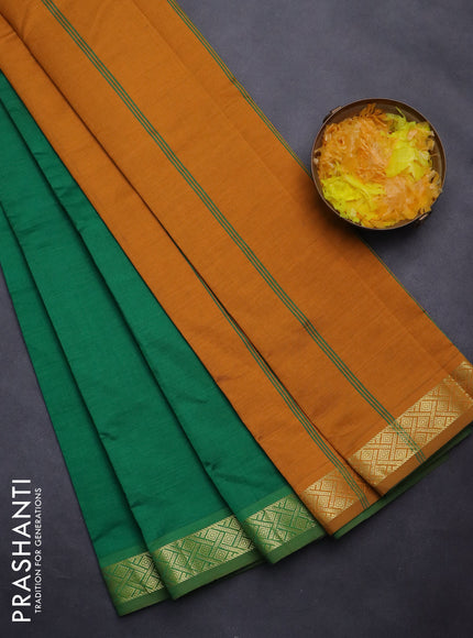 Semi silk cotton saree green and dark mustard with plain body and zari woven border