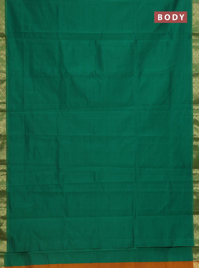 Semi silk cotton saree green and dark mustard with plain body and zari woven border