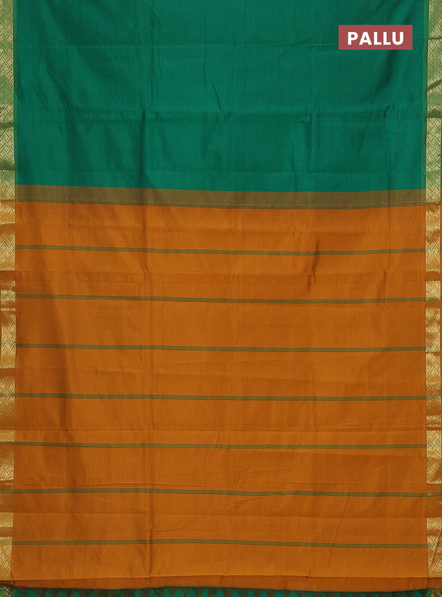 Semi silk cotton saree green and dark mustard with plain body and zari woven border