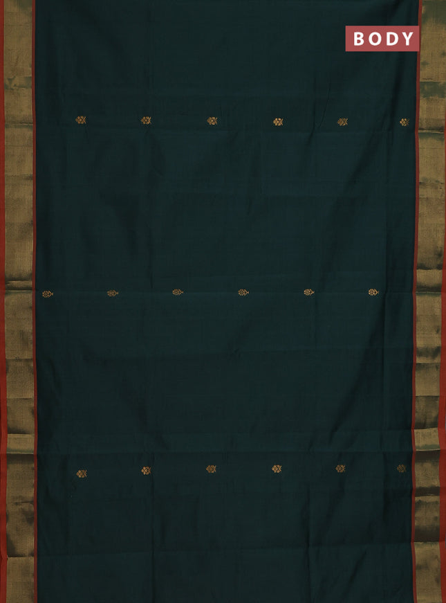 Semi silk cotton saree bottle green and orange with zari woven buttas and zari woven border
