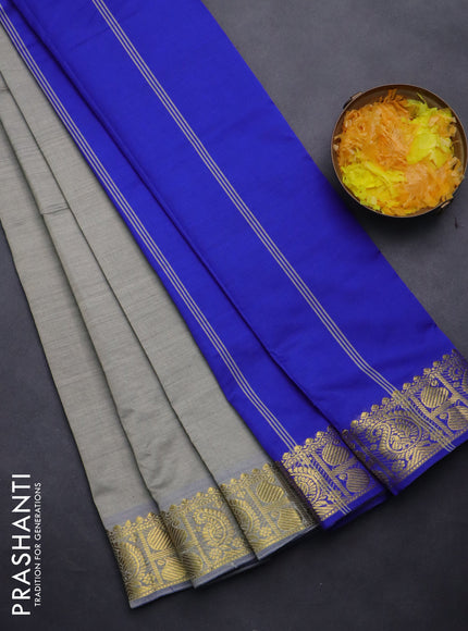 Semi silk cotton saree grey shade and blue with plain body and paisley zari woven border