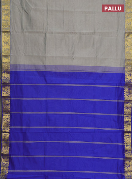 Semi silk cotton saree grey shade and blue with plain body and paisley zari woven border