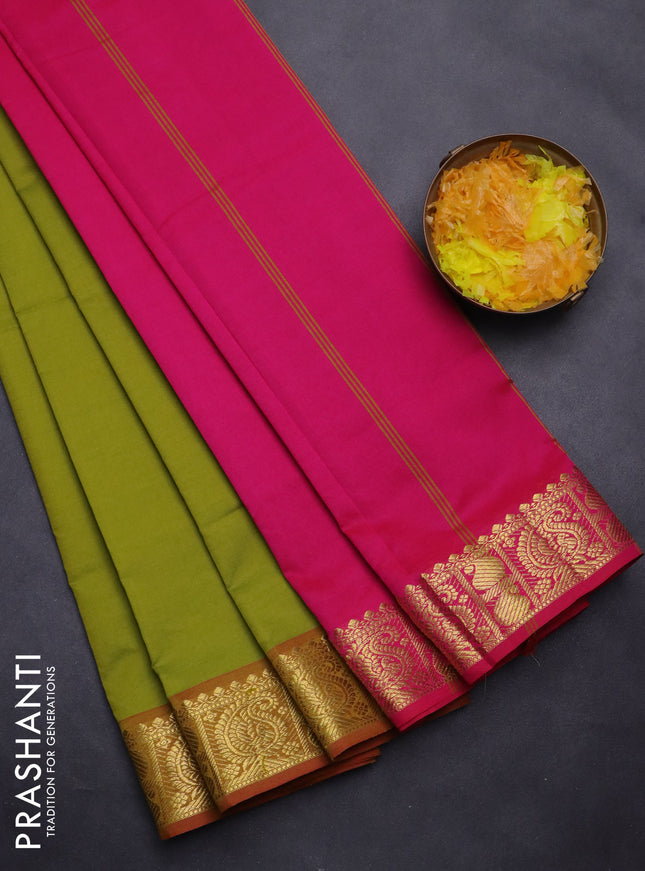 Semi silk cotton saree mustard green and pink with plain body and paisley zari woven border