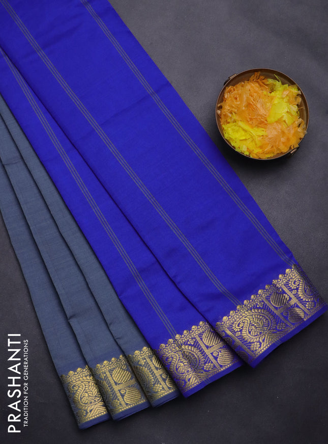 Semi silk cotton saree grey and blue with plain body and paisley zari woven border