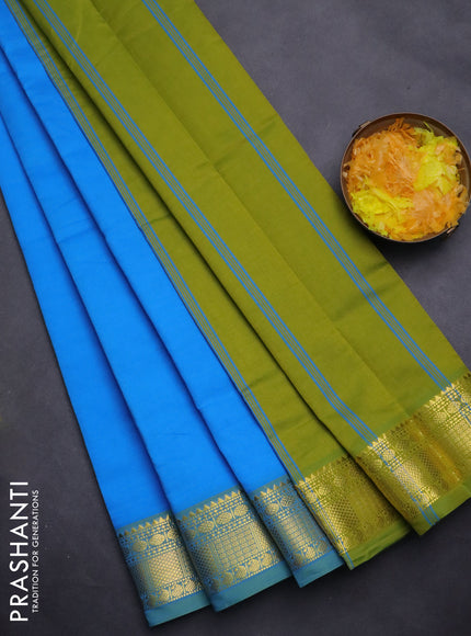 Semi silk cotton saree blue and light green with plain body and zari woven border