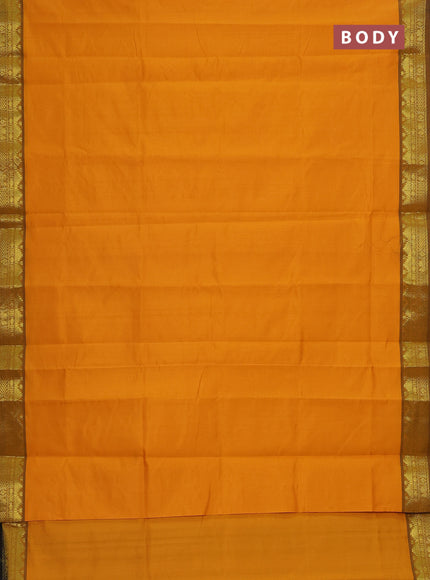 Semi silk cotton saree mustard yellow and black with plain body and zari woven border