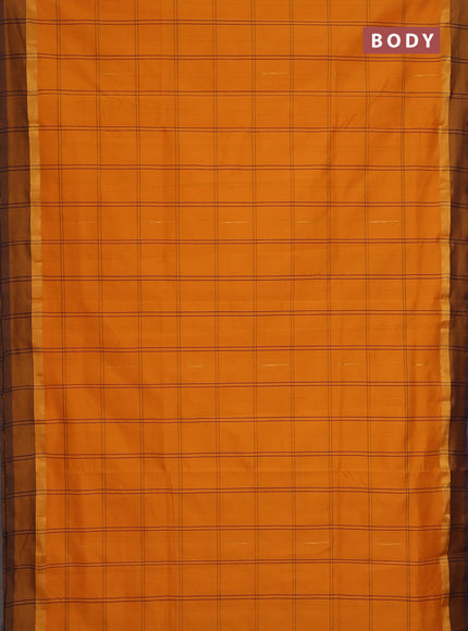 Semi silk cotton saree mango yellow and navy blue with allover checks & zari buttas and zari woven simple border