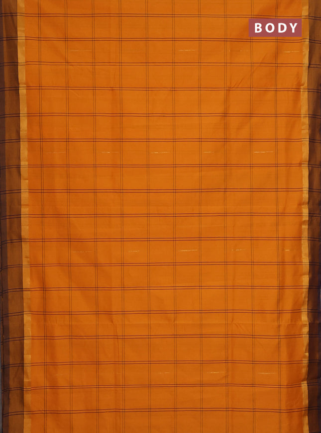 Semi silk cotton saree mango yellow and navy blue with allover checks & zari buttas and zari woven simple border