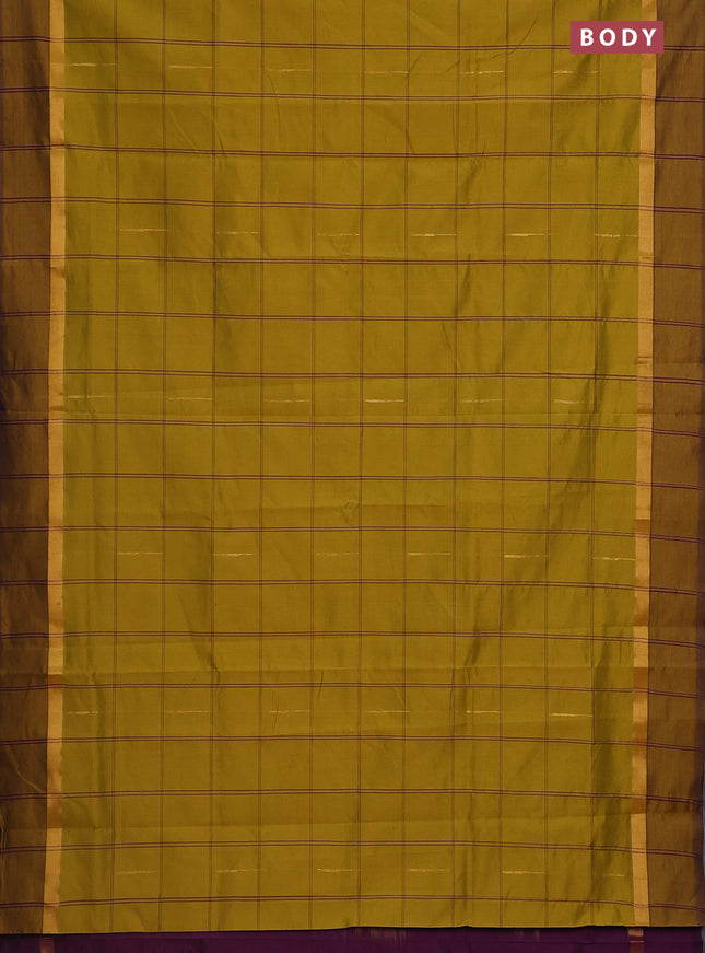 Semi silk cotton saree dark mustard and purple with allover checks & zari buttas and zari woven simple border