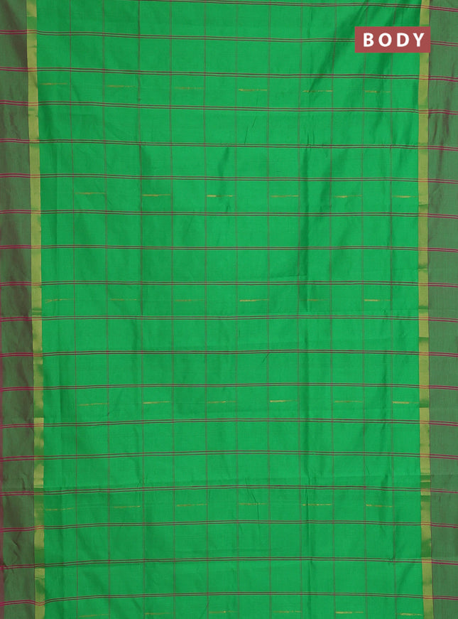 Semi silk cotton saree parrot green and pink with allover checks & zari buttas and zari woven simple border