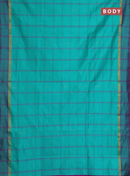 Semi silk cotton saree teal green shade and purple with allover checks & zari buttas and zari woven simple border