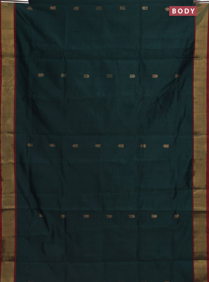 Semi silk cotton saree bottle green and pink with zari woven buttas and zari woven border