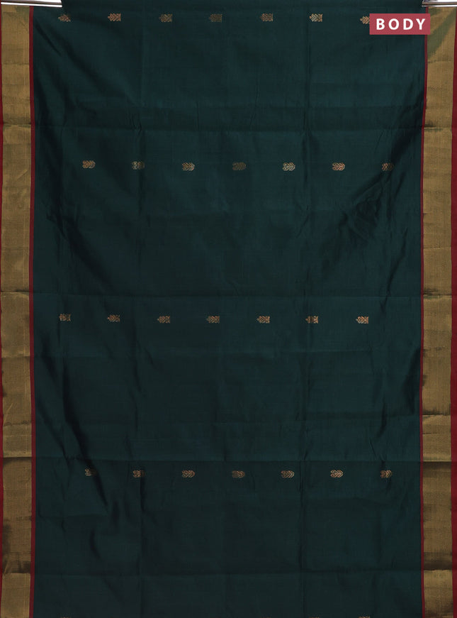 Semi silk cotton saree bottle green and pink with zari woven buttas and zari woven border