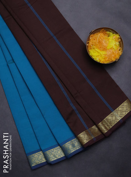 Semi silk cotton saree teal blue and brown with plain body and zari woven border