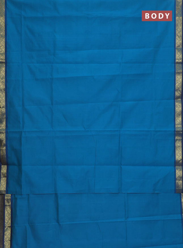Semi silk cotton saree teal blue and brown with plain body and zari woven border