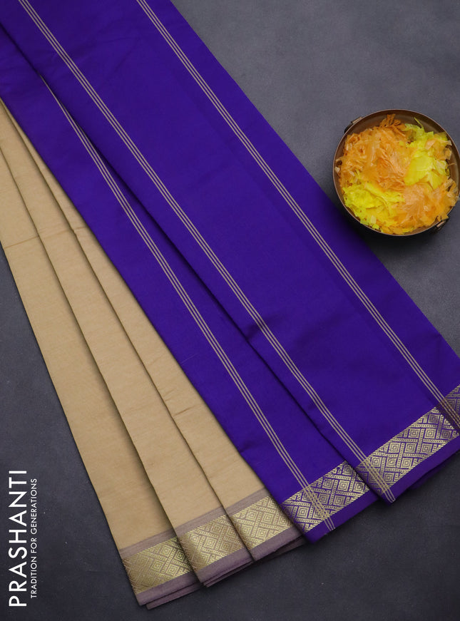 Semi silk cotton saree sandal and violet with plain body and zari woven border