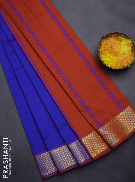 Semi silk cotton saree blue and rust shade with plain body and zari woven border