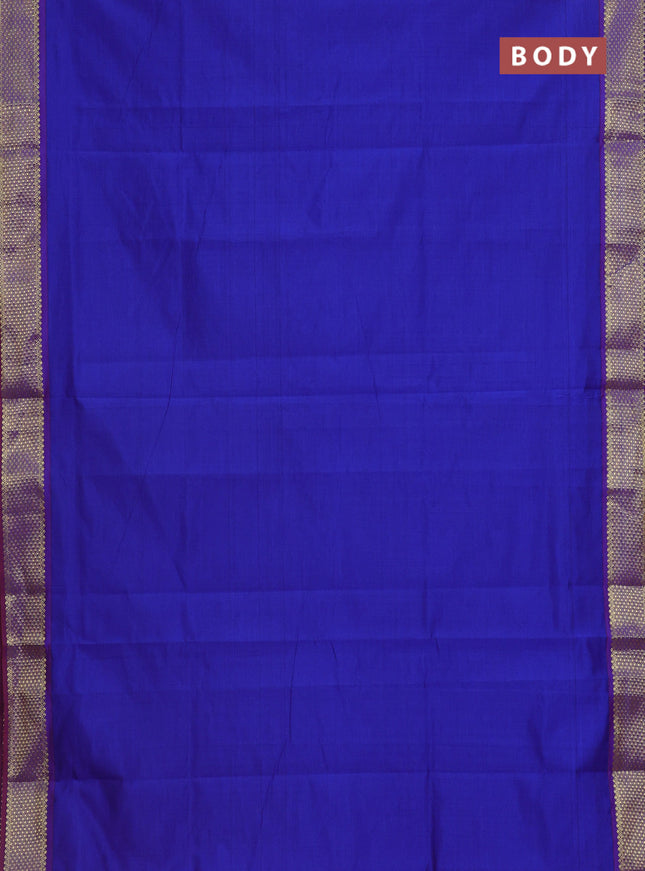 Semi silk cotton saree blue and rust shade with plain body and zari woven border