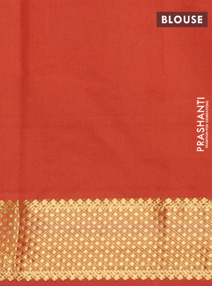 Semi silk cotton saree blue and rust shade with plain body and zari woven border