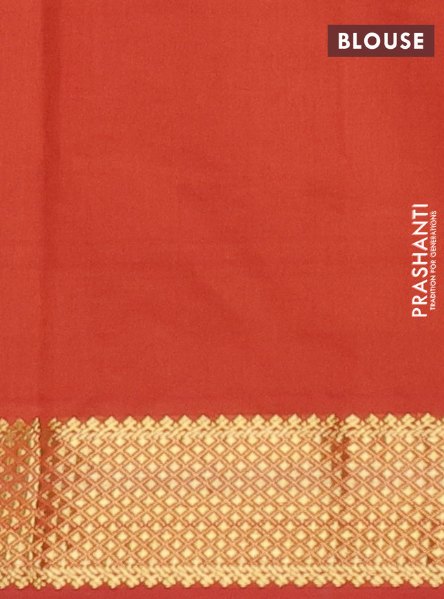 Semi silk cotton saree blue and rust shade with plain body and zari woven border