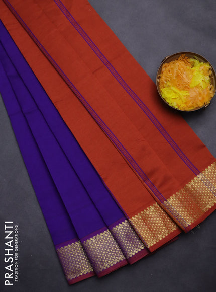 Semi silk cotton saree blue and rust shade with plain body and zari woven border