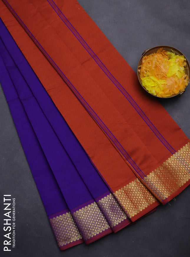 Semi silk cotton saree blue and rust shade with plain body and zari woven border