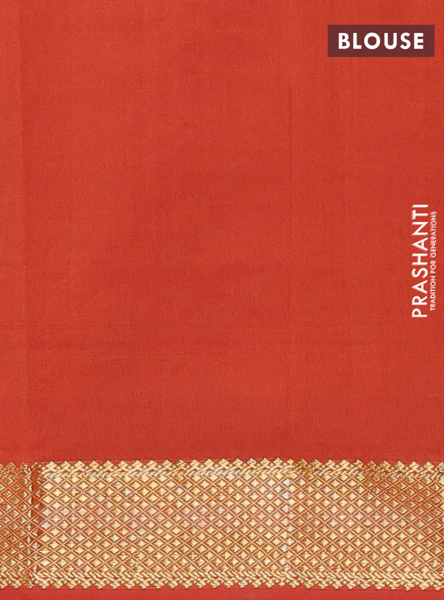 Semi silk cotton saree blue and rust shade with plain body and zari woven border