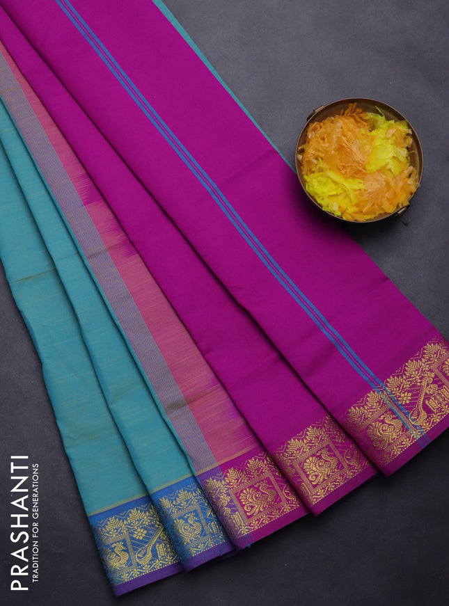 Semi silk cotton saree dual shade of teal blue and purple with plain body and zari woven border