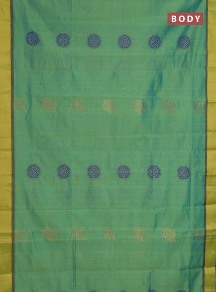 Semi silk cotton saree dual shade of green and violet with zari woven floral buttas and zari woven border