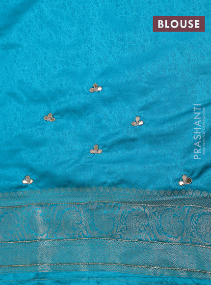 Banarasi silk saree teal blue shade with allover zari woven brocade weaves and zaridosi gotapatti work border