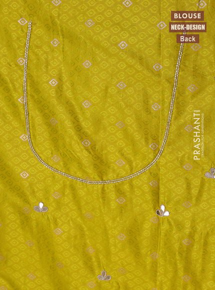 Banarasi silk saree lime yellow with allover zari woven brocade weaves and zaridosi gotapatti work border