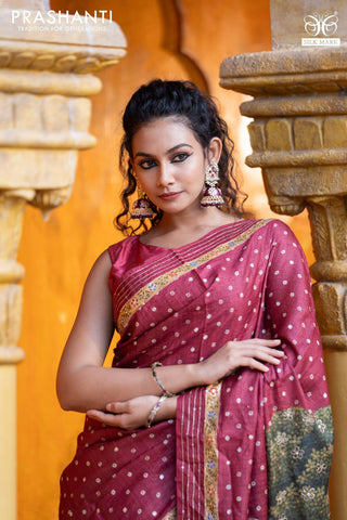 Pure tussar silk saree maroon with allover bandhani butta prints & pita work and zari line border