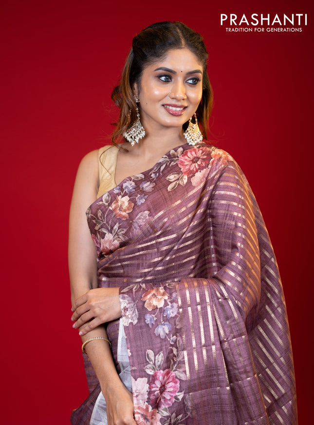 Semi tussar saree brown shade with allover zari woven stripes pattern and floral printed border