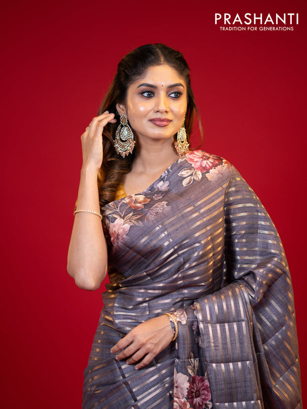 Semi tussar saree grey shade with allover zari woven stripes pattern and floral printed border