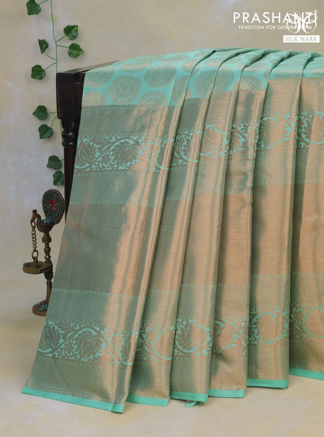 Pure kanchipuram silk saree green shade with allover zari woven butta weaves and long rich zari woven border