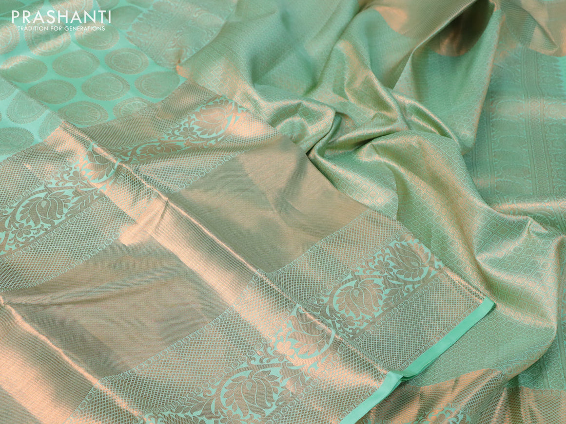 Pure kanchipuram silk saree green shade with allover zari woven butta weaves and long rich zari woven border