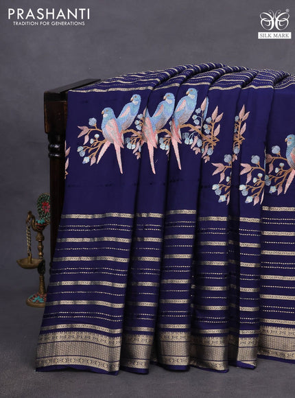 Pure crepe saree blue with allover zari weaves & embroidery work and zari woven border