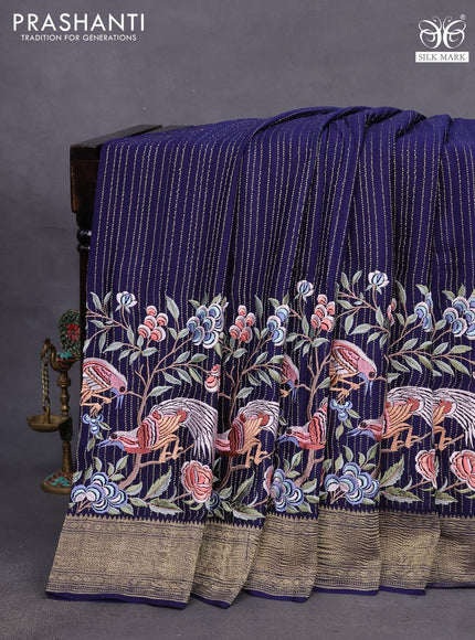 Pure crepe saree blue with allover zari weaves & embroidery work and zari woven border