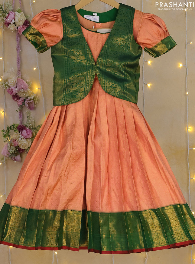 Silk kids frock peach orange and green with allover zari weaves and zari woven border for 3-4 years