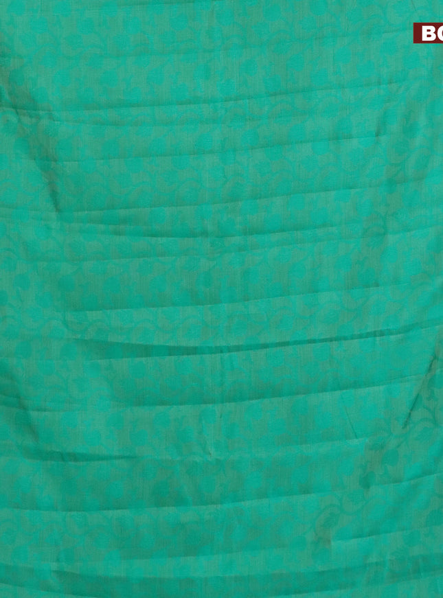 Semi raw silk saree teal green with allover self emboss and zari woven border