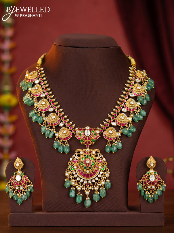 Jadau maanga necklace floral pendant with jadau stones and green beads hanging