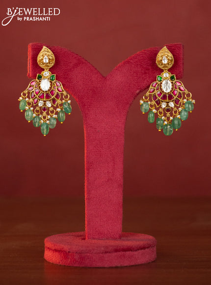 Jadau maanga necklace floral pendant with jadau stones and green beads hanging