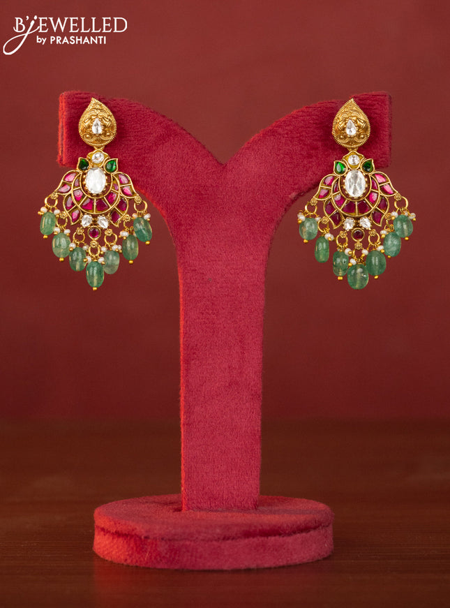 Jadau maanga necklace floral pendant with jadau stones and green beads hanging