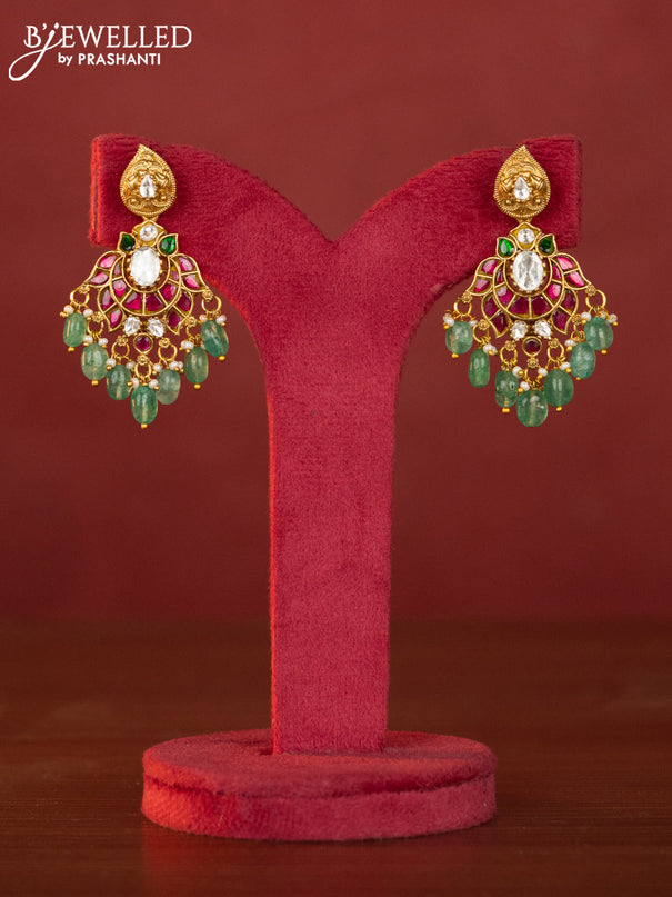 Jadau maanga necklace floral pendant with jadau stones and green beads hanging
