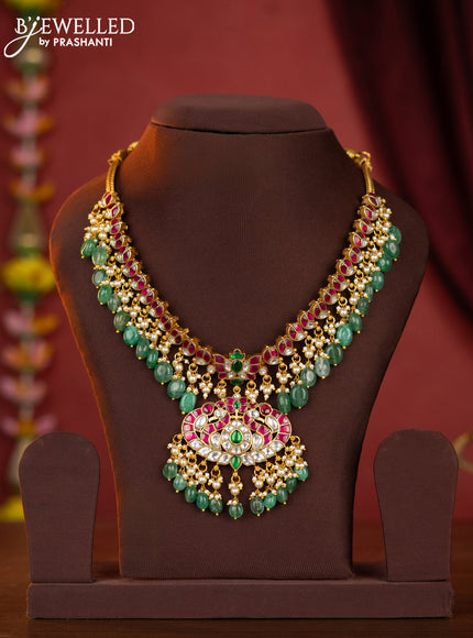 Jadau necklace double peacock pendant with jadau stones and green beads hanging