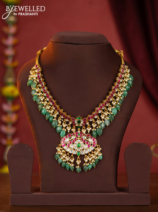 Jadau necklace double peacock pendant with jadau stones and green beads hanging