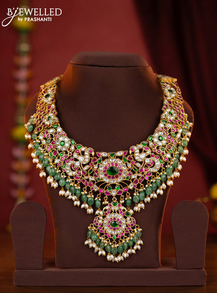 Jadau necklace double peacock pendant with jadau stones and green beads hanging