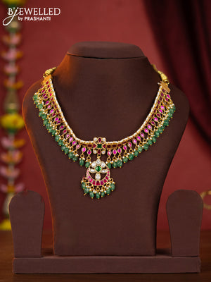Jadau attigai necklace with jadau stones and green beads hanging