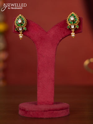 Jadau leaf floral design earring with green jadau stones and pearl hanging
